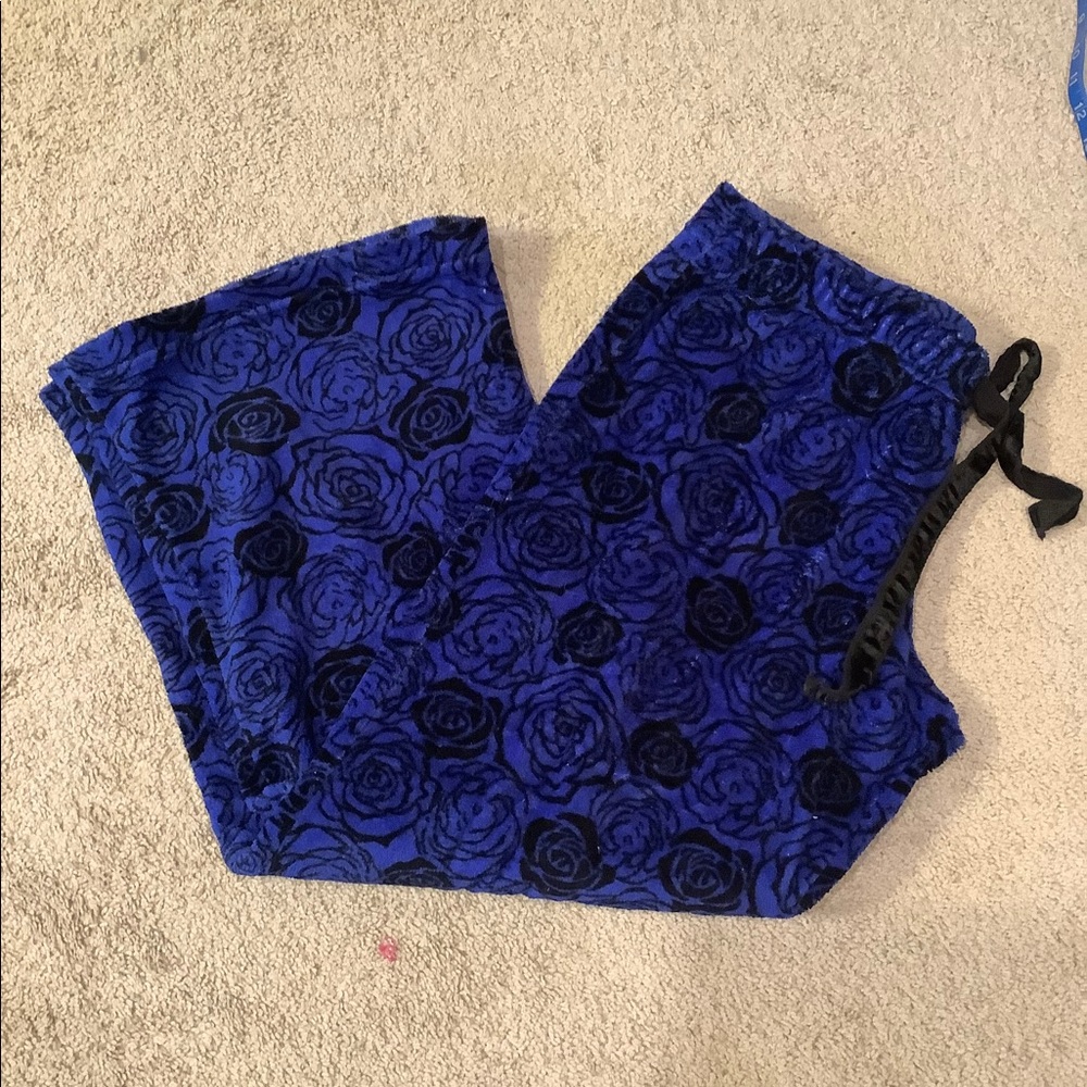 Warm and fuzzy blue pajama pants with black roses